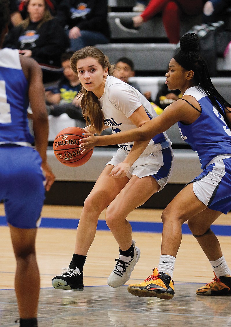 Capital City's Brooklynn Greene tries to dribble around Kansas City Central's Cai'Vion Boyles during a game last season at Capital City High School.