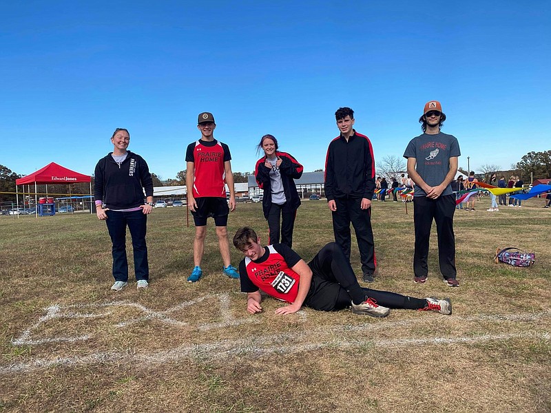 <p>Submitted photo</p><p>This year’s Prairie Home cross country team consisted of, in the back row from left to right: coach Marie Pope, Landon Case, Savanna Tracy, Allen Haslag and coach Sage Eichenburch. In the front row is Preston Scheidt. Will Wright is not pictured.</p>