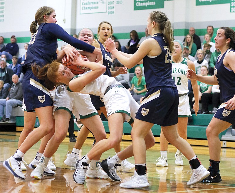 Autumn Bax of Blair Oaks battles to keep possession of the ball during Tuesday's game against Helias in Wardsville