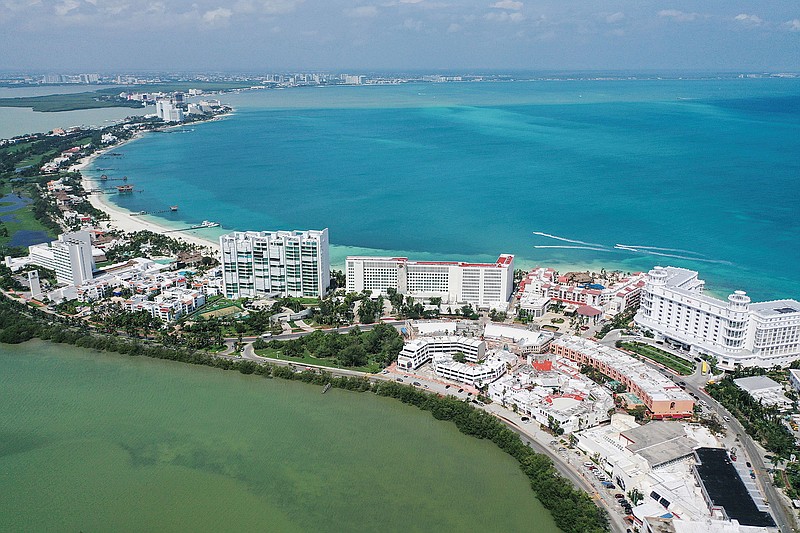 Aerial view of the Caribbean Sea and the lagoon in the touristic zone, after the passage of Hurricane Delta in Cancun, Quintana Roo state, Mexico, on Oct. 8, 2020. The CDC has assigned its highest-level advisory against traveling to Mexico, which has surpassed 1 million coronavirus cases. (Pedro Pardo/AFP/Getty Images/TNS)