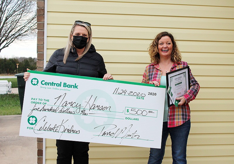 Nancy Hanson (right) was recognized by Central Bank for her kindness and awarded $500.