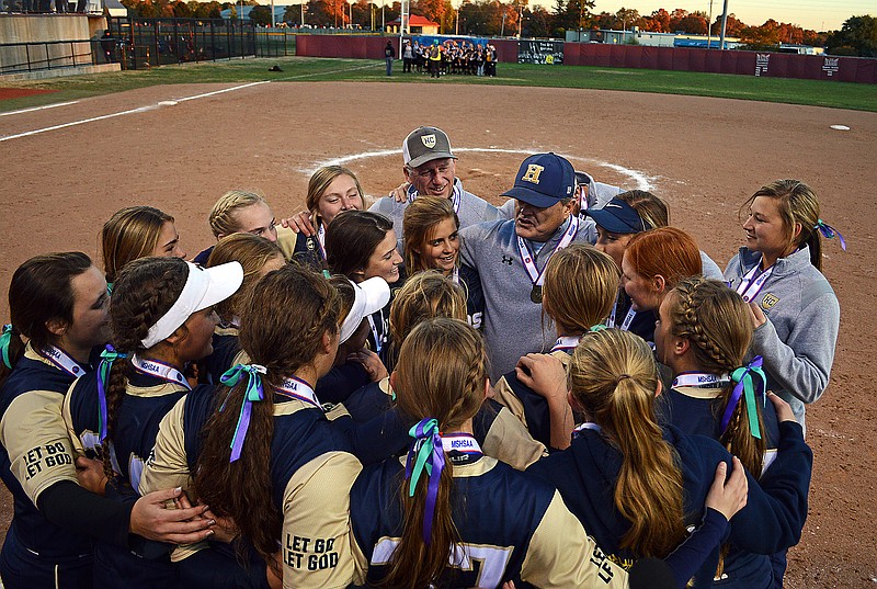 Helias softball coach Chris Wyrick speaks to the team following the 2019 Class 3 state championship game at Killian Softball Complex in Springfield. 