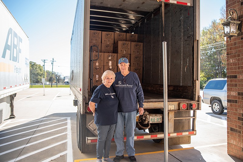 Carolyn and Billy Sparkman stand in front of a truck packed full of boxes for Operation Christmas Child. The charity is a year-round endeavor for the couple. They have been working with the organization for
about 20 years.