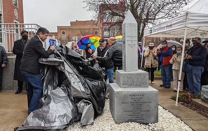 Callaway County Commissioners Roger Fischer, left, Randy Kleindienst and Gary Jungermann reveal the county's new Bicentennial Monument on Wednesday. Located at the Callaway County Courthouse, the monument celebrates the county's 200th birthday.