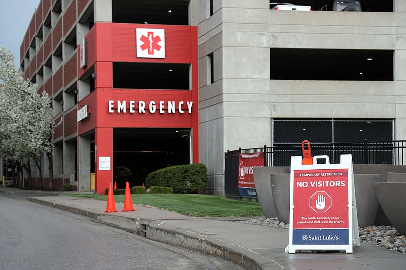 A sign outside St. Luke's Hospital turns away visitors as the Coronavirus Pandemic causes a climate of anxiety and changing routines in America on April 2, 2020 in Kansas City, Missouri. (Photo by Jamie Squire/Getty Images/TNS)