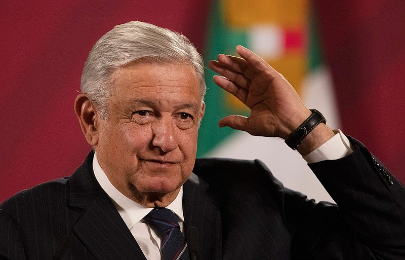 Mexican President Andres Manuel Lopez Obrador gives his daily, morning news conference at the presidential palace, Palacio Nacional, in Mexico City, Friday, Oct. 16, 2020. Lpez Obrador said Friday that his ambassador to the United States told him two weeks ago that there was an investigation underway there involving Mexico's former defense secretary, retired Gen. Salvador Cienfuegos, who was arrested Thursday in Los Angeles. (AP Photo/Marco Ugarte)