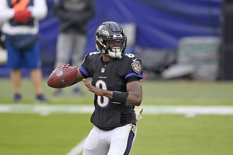 Ravens quarterback Lamar Jackson drops back for a pass during the first half of Sunday's game against the Titans in Baltimore.