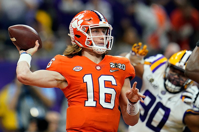 In this Jan. 13, 2020, file photo, Clemson quarterback Trevor Lawrence throws a pass against LSU during the first half of a NCAA College Football Playoff national championship game in New Orleans. The college quarterbacks class is shaping up nicely, just in time to perhaps rescue some NFL teams from themselves. (AP Photo/David J. Phillip, File)