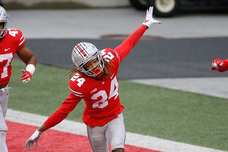 Ohio State defensive back Shaun Wade celebrates his interception and touchdown against Indiana during the second half of an NCAA college football game Saturday, Nov. 21, 2020, in Columbus, Ohio. Ohio State beat Indiana 42-35. (AP Photo/Jay LaPrete)