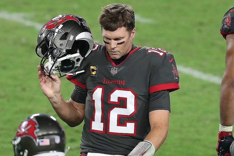 Buccaneers quarterback Tom Brady reacts as he leaves the field after throwing an interception during last Monday night's game against the Rams in Tampa, Fla.