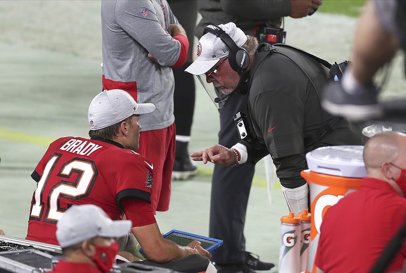 Tampa Bay coach Bruce Arians talks to quarterback Tom Brady during the second half of Sunday's game against the Chiefs in Tampa, Fla.