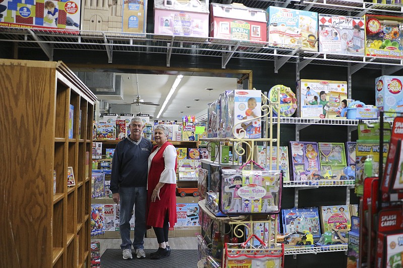 Liv Paggiarino/News Tribune

Marla and Tom Nilges stand for a portrait inside their shop on McCarty Street, Classroom Connection Educational Materials, on Thursday afternoon. Classroom Connection will be going out of business, and the Nilges are currently offering a 35% discount across the store to get rid of their supply. They intend to move their other family business, the Cotter Pin Cellar, into the building, which they own.