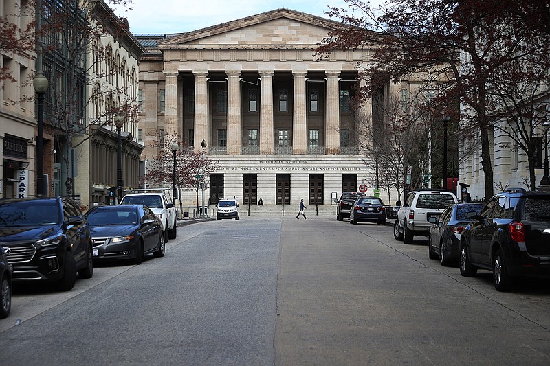 The Smithsonian National Portrait Gallery stands in the Penn Quarter neighborhood of Washington, D.C., which is unusually empty of vehicle traffic and pedestrians due to the coronavirus outbreak, on March 17, 2020. (Chip Somodevilla/Getty Images/TNS)