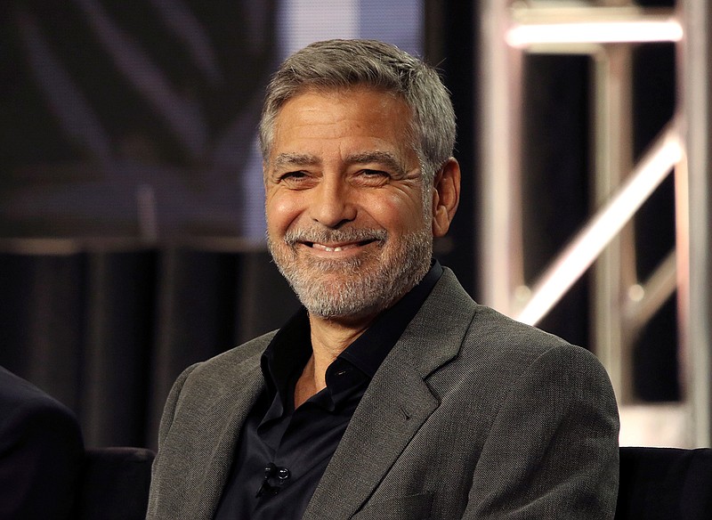 In this Feb. 11, 2019 file photo, George Clooney participates in the "Catch-22" panel during the Hulu presentation at the Television Critics Association Winter Press Tour at The Langham Huntington in Pasadena, Calif. In a Sunday, Nov. 29, 2020, interview on "CBS Sunday Morning," Clooney said he's been cutting his own hair for more than two decades with a Flowbee device. (Photo by Willy Sanjuan/Invision/AP, File)