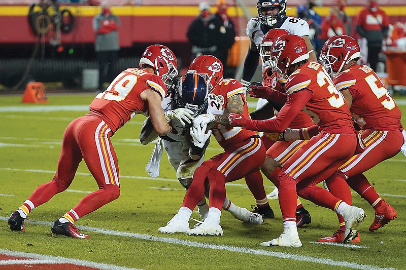 Chiefs rally to beat Broncos to clinch playoff berth