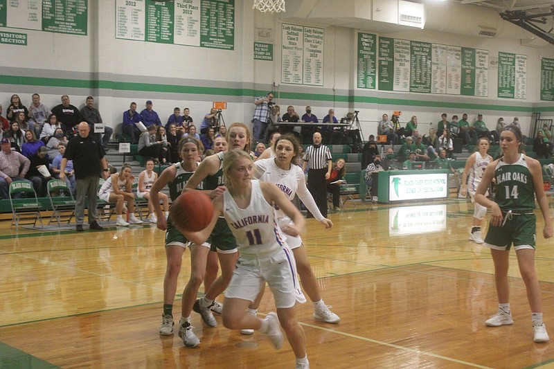 <p>Democrat photo/Kevin Labotka</p><p>Bailey Lage saves the ball Dec. 4 during the Pintos’ loss to Blair Oaks in the third place game of the Tri-County Conference Tournament.</p>