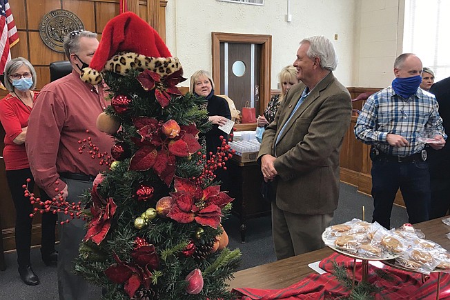 Arkansas 8th South Judicial District Judge Kirk Johnson, right, mingles with guests at his retirement reception Monday afternoon inside the Miller County Courthouse. Johnson has more than 40 years of judicial service in Southwest Arkansas.