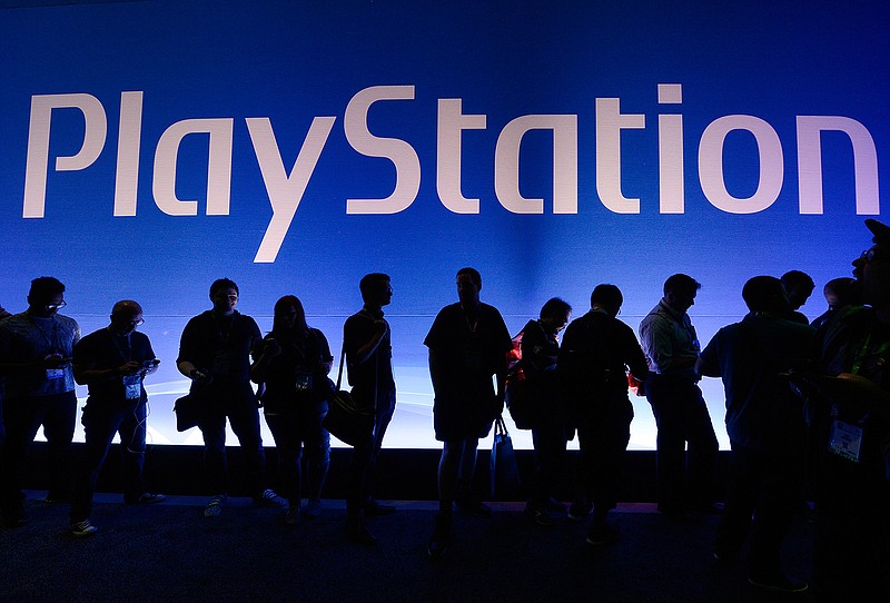 Gamers wait in line to enter the Sony Playstation booth during the annual E3 2016 gaming conference at the Los Angeles Convention Center in June 2016 in Los Angeles, Calif. 