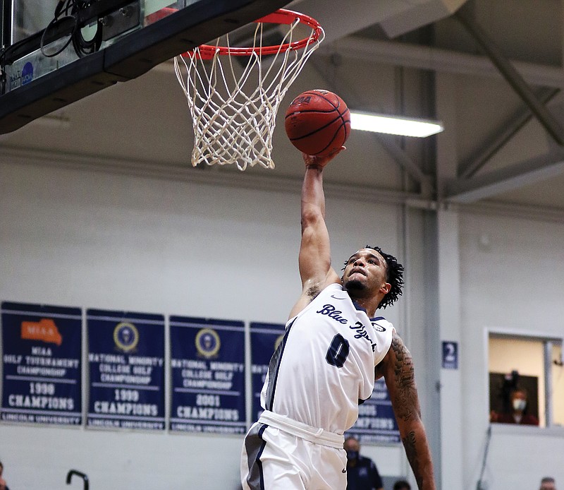 Lincoln guard Cameron Potts leaps into the air to attempt a dunk during Thursday night's game against Pittsburg State at Jason Gym.