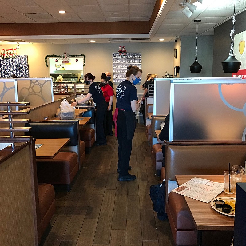 IHOP employees tend to their customers' needs on Christmas Day in Texarkana. IHOP, along with about three other Texarkana restaurants usually make it a point to stay open on Christmas Day.