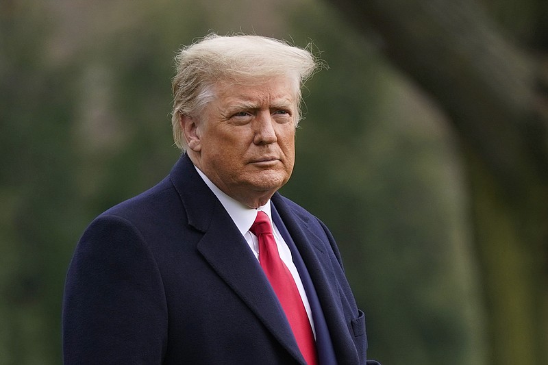 FILE - In this Dec. 12, 2020, file photo President Donald Trump walks on the South Lawn of the White House in Washington before boarding Marine One. (AP Photo/Patrick Semansky, File)