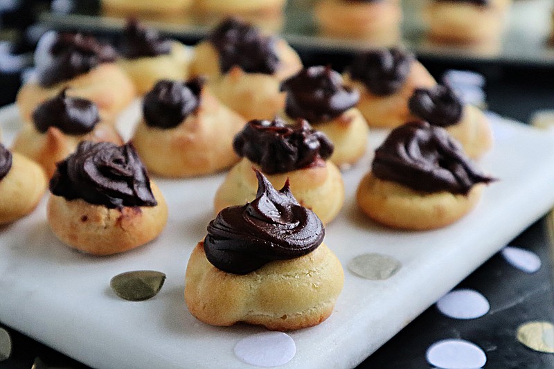 These airy, tender puffs are filled with a ganache made from dark chocolate and Nutella. Because they're bite-sized, they're perfect for a party.  (Gretchen McKay/Post-Gazette/TNS)