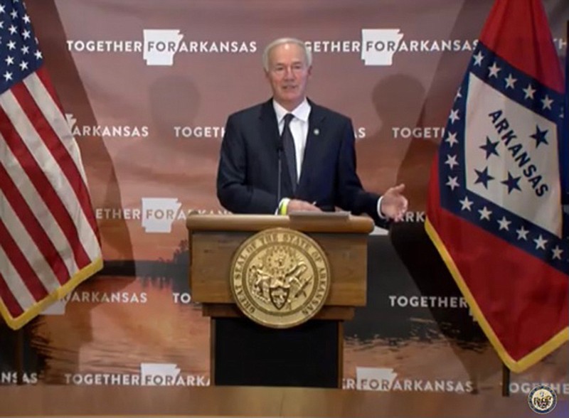 Arkansas Gov. Asa Hutchinson speaks Tuesday at a press briefing in Little Rock in this image taken from video posted on YouTube.  (YouTube via Texarkana Gazette)
