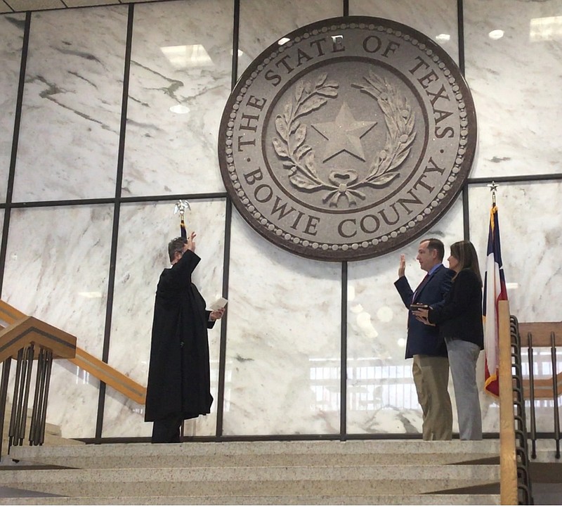 Bowie County Sheriff Jeff Neal, second from right, is sworn in Friday morning.