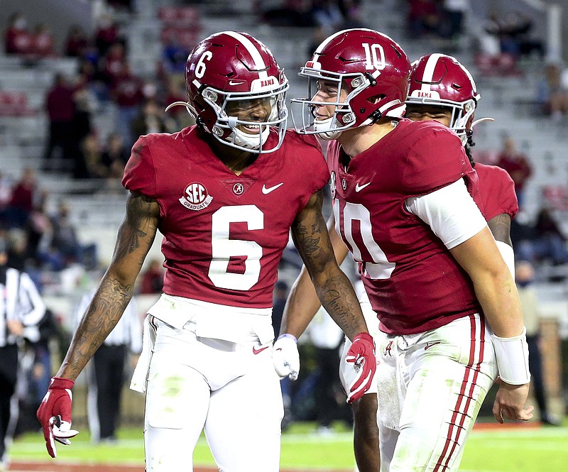 In this Oct. 31, 2020, file photo, Alabama wide receiver DeVonta Smith (6) and quarterback Mac Jones (10) celebrate a touchdown pass during the second half of a game against Mississippi State in Tuscaloosa, Ala.
