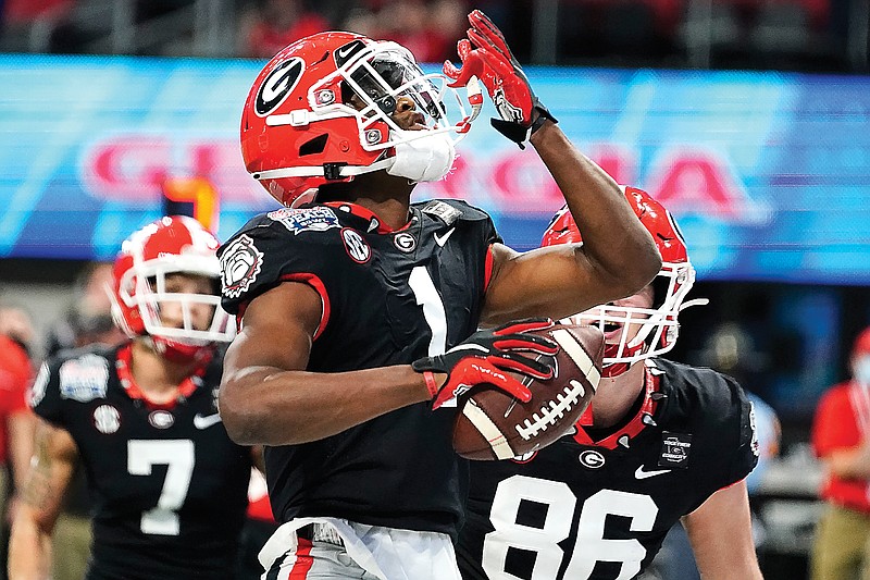 Georgia wide receiver George Pickens celebrates his touchdown catch against Cincinnati during the first half of the Peach Bowl on Friday in Atlanta.