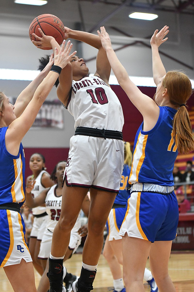 Liberty-Eylau's Tamara Norris goes for the shot as Dodd City's Rion Baccus, right, defends Saturday at Rader Dome in Texarkana, Texas. (Photo by Kevin Sutton)
