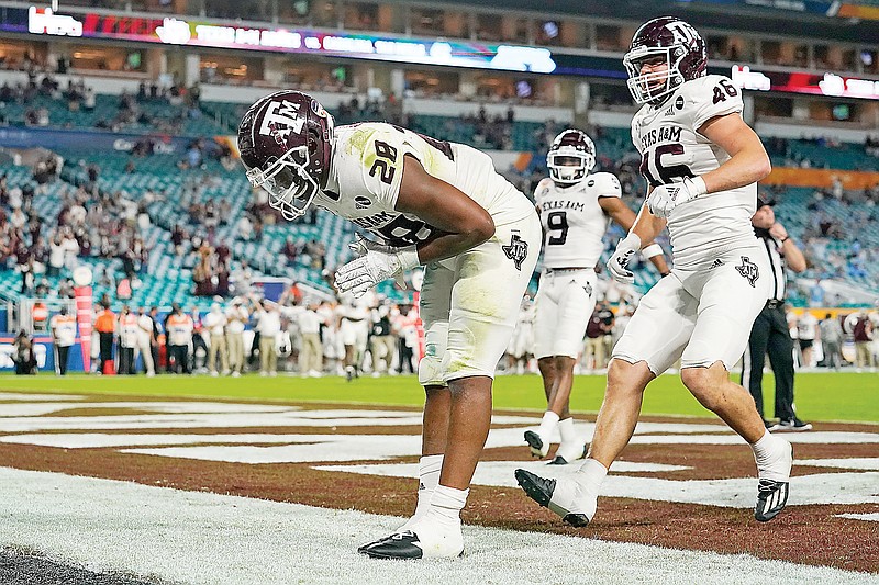 Texas A&M running back Isaiah Spiller takes a bow after scoring a touchdown during the Orange Bowl game against North Carolina on Saturday in Miami Gardens, Fla.