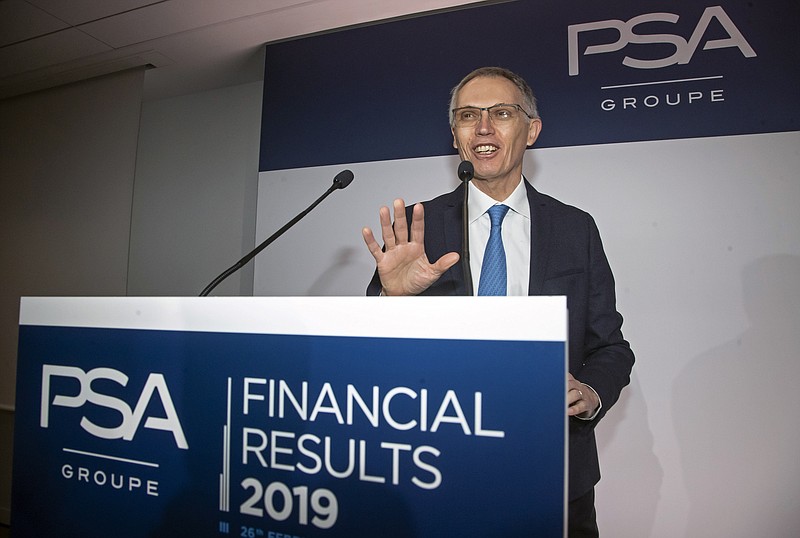 FILE - In this Wednesday, Feb. 26, 2020 file photo, CEO of PSA Groupe Carlos Tavares arrives for the presentation of the company's 2019 full year results in Rueil-Malmaison, west of Paris.  Fiat Chrysler Shareholders of Fiat Chrysler and France's PSA Group are meeting Monday, Jan. 4, 2021 to vote on a merger that will create the world's fourth-largest automaker. The new company called Stellantis will be run by PSA CEO Carlos Tavares, who is known for cutting vehicles or ventures that don't make money.(AP Photo/Michel Euler, File)