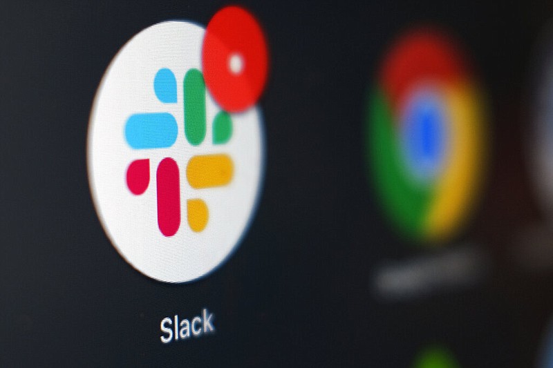 This Dec. 2, 2020, photo shows the Slack app icon being displayed on a computer screen in Tokyo.