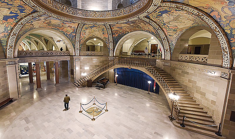 A lone individual passes through an empty first floor rotunda Tuesday, Jan. 5, 2021, at the Missouri Capitol.