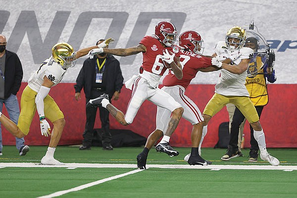 Alabama receiver DeVonta Smith sprints to the end zone for a touchdown after making a catch last Friday in the Rose Bowl in Arlington, Texas.