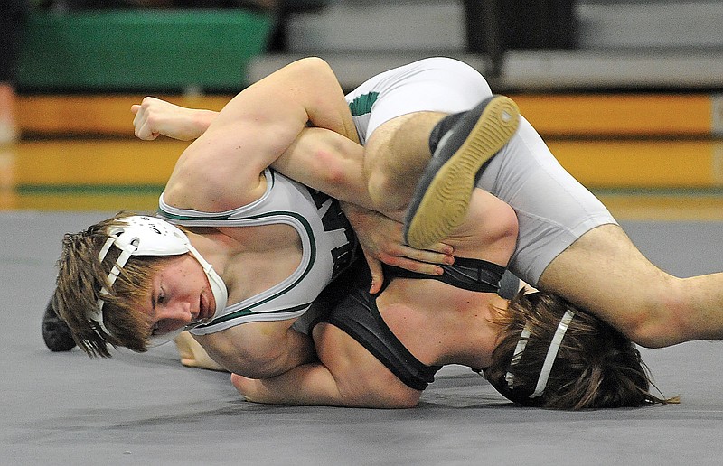 Blair Oaks' Doug Blaha tangles with Mathias Lobb of North Callaway on Tuesday during a 152-pound pound match in Wardsville. 