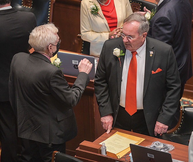 Reps. Rudy Veit, left, and Dave Griffith, both of Jefferson City, visit Wednesday prior to the start of official activities as Missouri's 101st General Assembly got underway in the Missouri House of Representatives.