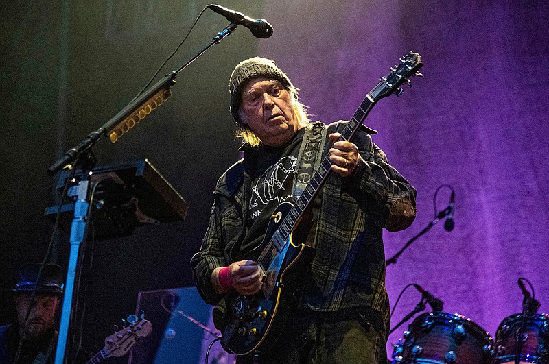 In this May 25, 2019, file photo, Neil Young performs at the BottleRock Napa Valley Music Festival at Napa Valley Expo in Napa, Calif. Young has become the latest artist to strike gold with his song catalog. The Hipgnosis Songs Fund, a British investment company, announced that it had acquired a 50 percent stake in Young's catalog of some 1,180 songs that include "Heart of Gold," "Rockin' in the Free World" and "Cinnamon Girl." (Photo by Amy Harris/Invision/AP, File)