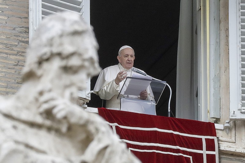 FILE - In this Dec. 8, 2020 file photo, Pope Francis delivers his message during the Angelus noon prayer from the window of his studio overlooking St.Peter's Square, on the Immaculate Conception day, at the Vatican. The pope said in an interview with Mediaset that is to be broadcast Sunday, Jan. 10, 2021 that he was “astonished” by the mob attack at the U.S. Capitol due to the democratic traditions of the United States.  (AP Photo/Andrew Medichini, file)