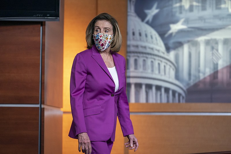 Speaker of the House Nancy Pelosi, D-Calif., holds a news conference on the day after violent protesters loyal to President Donald Trump stormed the U.S. Congress, at the Capitol in Washington, Thursday, Jan. 7, 2021. (AP Photo/J. Scott Applewhite)