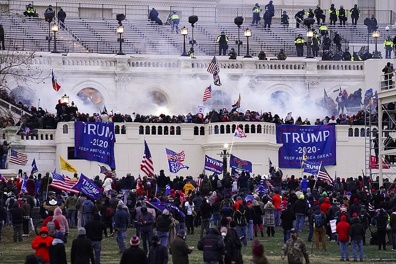 In this Wednesday, Jan. 6, 2021, photo, violent protesters, loyal to President Donald Trump, storm the Capitol, in Washington.