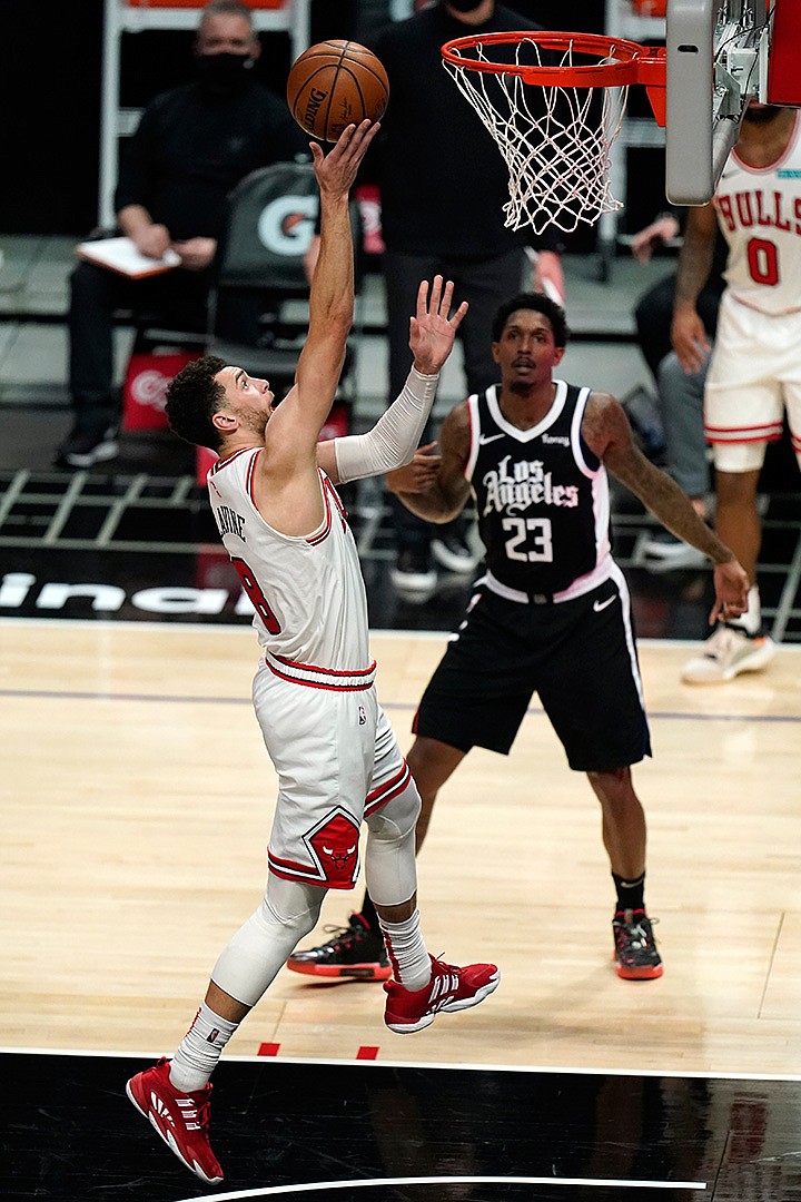 Chicago Bulls guard Zach LaVine, left, scores against the Los Angeles Clippers during the second half Sunday, January 10, 2021, in Los Angeles.