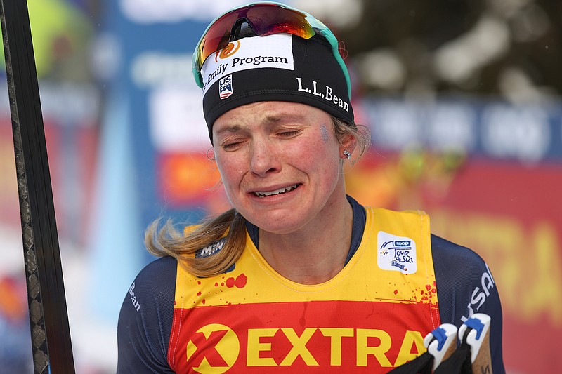 United States' Jessie Diggins bursts into tears after completing a women's Tour de Ski, cross-country 10K mass start event, in Val di Fiemme, Italy, Sunday, Jan. 10, 2021. Diggins finished in second placed and clinched the Tour de Ski trophy. (AP Photo/Alessandro Trovati)