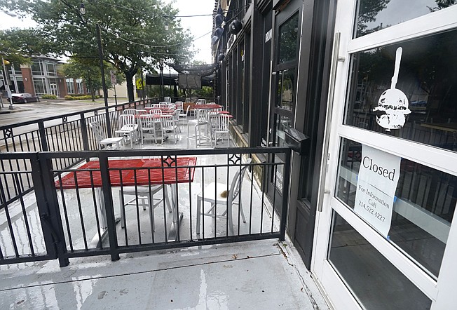  In this Sept. 2, 2020 file photo, a closed burger eatery sits empty in Dallas. The economic damage in Texas from the coronavirus pandemic has left a nearly $1 billion deficit in the state budget. The forecast by Texas Republican Comptroller Glenn Hegar on Monday, Jan. 11, 2021, reflects how the nation's energy capital remains hampered by a slow recovery and a half-million fewer jobs than a year ago. (AP Photo/LM Otero)