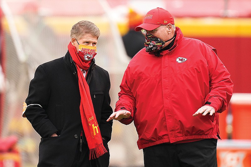 Chiefs owner Clark Hunt (left) talks with head coach Andy Reid before a game earlier this month against the Chargers at Arrowhead Stadium in Kansas City.