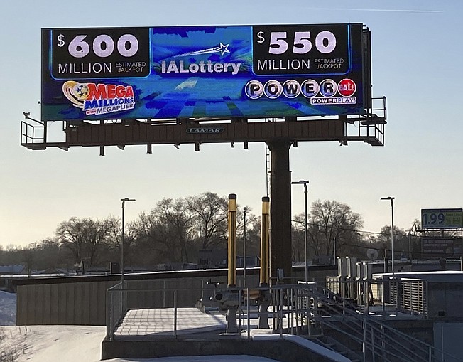 A digital billboard in Des Moines, Iowa, on Monday shows jackpots for the Mega Millions and Powerball games. Lottery players have a chance to win the largest jackpots in nearly two years as Mega Millions has grown to $600 million and Powerball has climbed to $550 million.
