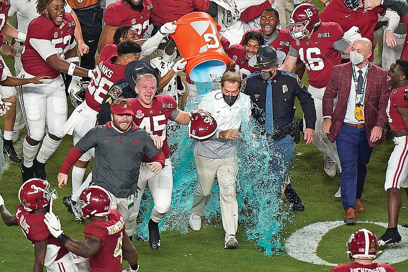 Alabama head coach Nick Saban is soaked in a sports drink after Monday's win against Ohio State in the College Football Playoff national championship game at Miami Gardens, Fla.