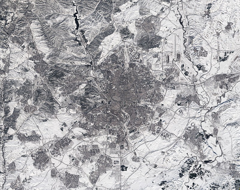 In this photo made available on Tuesday, Jan. 12, 2021, by the European Space Agency, a view of a Copernicus Sentinel-2 image of Madrid, Spain. The image appears to have been taken in black and white. In fact, it is a true-colour image – but the heaviest snowfall in 50 years has blanketed the region, turning the landscape white. Much of Spain is struggling to return to normality three days after a 30-hour-long record snowfall that was then hardened by record-low temperatures, turning streets and roads into dangerous ice sheets in areas not used to extreme winters.  (European Space Agency via AP)