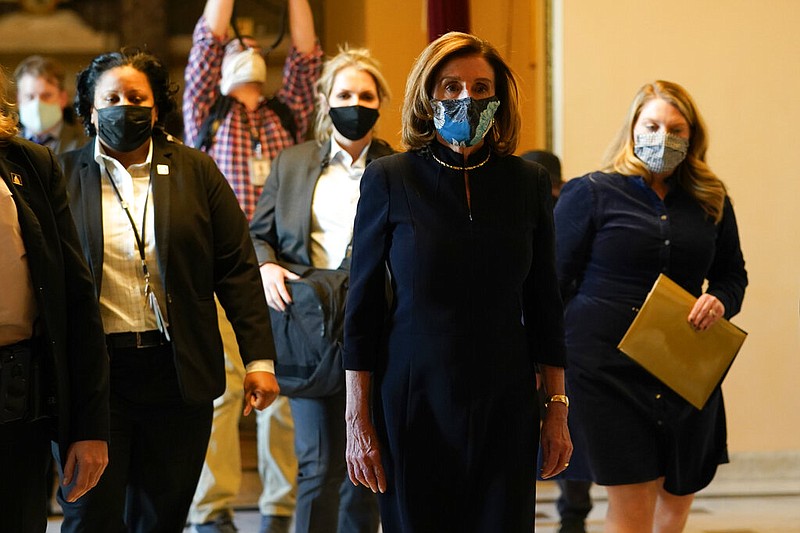 Speaker of the House Nancy Pelosi, D-Calif., walks to the House chamber to lead the final vote of the impeachment of President Donald Trump, for his role in inciting an angry mob to storm the Congress last week, at the Capitol in Washington, Wednesday, Jan. 13, 2021.